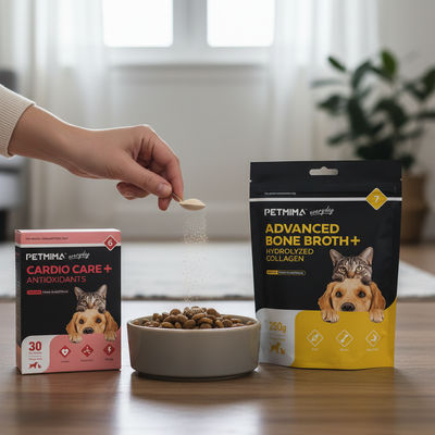 Person adding powder from a spoon to a bowl of pet food with Petima product packaging in the background.