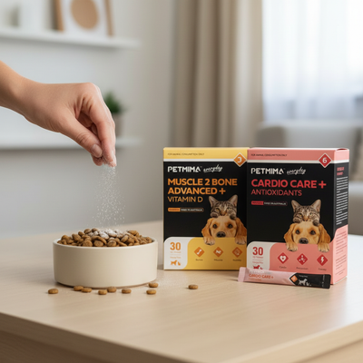 Person adding pet food to a bowl with Petima supplement boxes in the background.